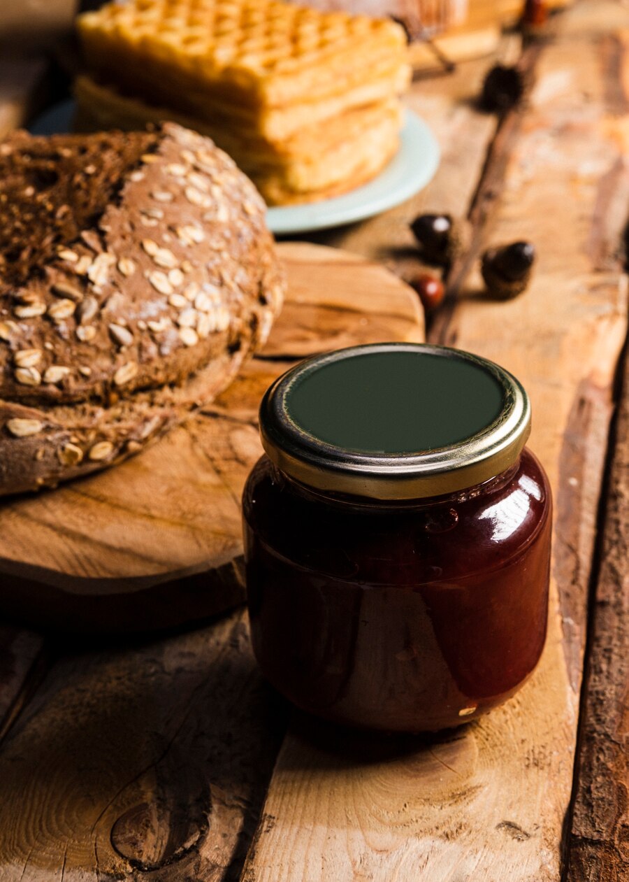 high-angle-assortment-with-baked-food-jam-jar_23-2148234342